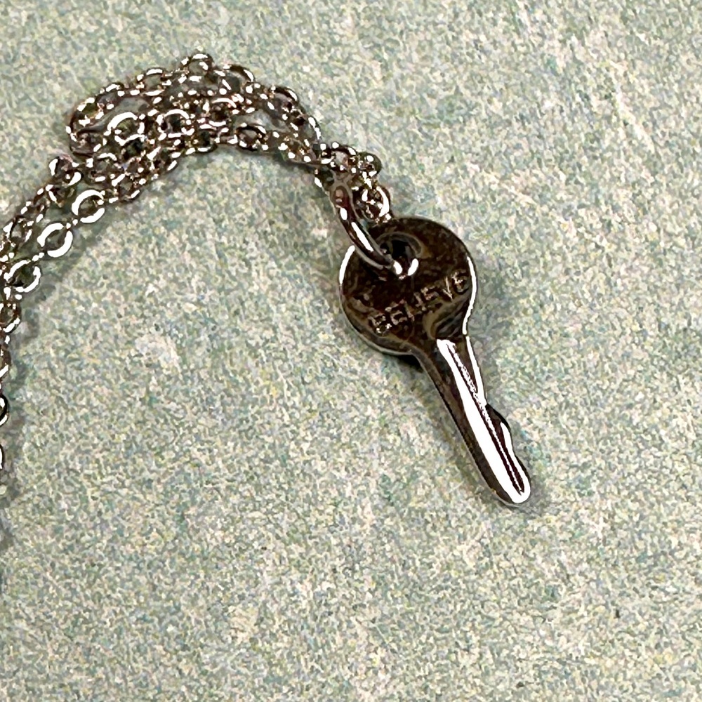 The Giving Trees Believe dainty tiny silver key charm
